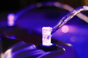 purple glowing hot tub jets in the dark