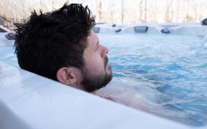 Ryan Truex sits in his hot tub facing away from the camera.