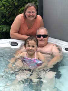 Andrea and Her Family in their Marquis Hot Tub